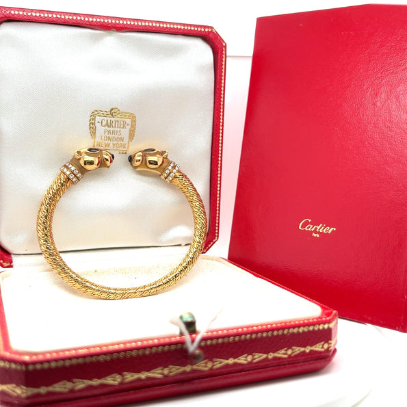 Bracelet jonc Panthère à double tête signé Cartier en or 18 carats avec boîte et papiers d'origine
