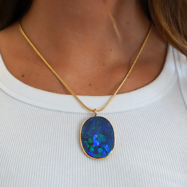 GIA Certified 35 Carat Marcus & Co Australian Black Opal in 18K Gold Pendant