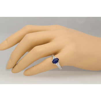 Oval cut Natural Blue Sapphire with natural baguette cut diamonds in 18k solid white gold – Assay Jewelers